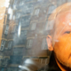 Buildings are reflected in the window as WikiLeaks founder Julian Assange is taken from court, where he appeared on charges of jumping British bail seven years ago, in London, Wednesday May 1, 2019.